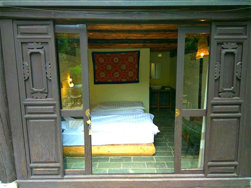 Lijiang Baisha Free Time Designed Hotel Exterior foto